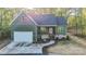 New construction home with a charming facade, attached garage, and a stone driveway lined by tall trees at 472 Oak Rd # 114/115/116, Norwood, NC 28128