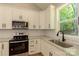 Modern kitchen features stainless steel appliances, granite countertops, and subway tile backsplash at 472 Oak Rd # 114/115/116, Norwood, NC 28128