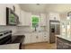 New kitchen features granite countertops, stainless steel appliances, and ample cabinet space at 472 Oak Rd # 114/115/116, Norwood, NC 28128