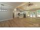 Bright open-concept living space with cathedral ceiling, wood floors, and modern kitchen with center island at 472 Oak Rd # 114/115/116, Norwood, NC 28128