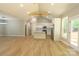 Bright open-concept living space with cathedral ceiling, wood floors, and modern kitchen with center island at 472 Oak Rd # 114/115/116, Norwood, NC 28128