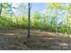 Cleared lot ready for your dream home in a private, wooded location. Excavator present for ongoing site work at 472 Oak Rd # 114/115/116, Norwood, NC 28128