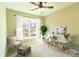 Staged home office with a large window, custom desk setup, and relaxing sitting area at 472 Oak Rd # 114/115/116, Norwood, NC 28128