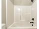 Clean, bright shower and tub featuring white tile and modern fixtures at 472 Oak Rd # 114/115/116, Norwood, NC 28128