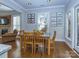 Bright and airy dining room with wood floors, table and seating, and plenty of light at 547 Ashby Dr, Davidson, NC 28036