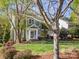 Charming two-story home with a well-manicured lawn, inviting entrance, and convenient covered carport at 547 Ashby Dr, Davidson, NC 28036