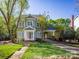 Charming two-story home with a well-manicured lawn, inviting entrance, and convenient covered carport at 547 Ashby Dr, Davidson, NC 28036