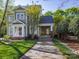 Charming two-story home with a well-manicured lawn, inviting entrance, and convenient covered carport at 547 Ashby Dr, Davidson, NC 28036