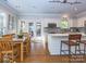 Open-concept kitchen features stainless appliances, a breakfast bar, and plenty of natural light at 547 Ashby Dr, Davidson, NC 28036