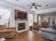 Open living area with fireplace flows into the dining area with lots of natural light at 547 Ashby Dr, Davidson, NC 28036