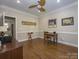 Bright office space with hardwood floors, elegant molding, ceiling fan and natural light at 547 Ashby Dr, Davidson, NC 28036
