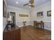 Bright office space with hardwood floors, elegant molding, ceiling fan and natural light at 547 Ashby Dr, Davidson, NC 28036