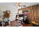 This room features a ceiling fan, desk, decor and hardwood floors, creating a unique space at 5854 Crimson Oak Ct, Harrisburg, NC 28075