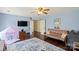 Large bonus room with wood floors, futon sofa, and a play tent at 5854 Crimson Oak Ct, Harrisburg, NC 28075