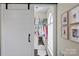Walk-in closet with a sliding barn door and clothing on hangers at 5854 Crimson Oak Ct, Harrisburg, NC 28075