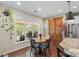 Sunlit eat-in kitchen featuring stainless steel appliances, granite countertops, and a large window at 5854 Crimson Oak Ct, Harrisburg, NC 28075
