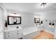 A luxurious bathroom with soaking tub, tile surround and dual vanity at 6730 Gold Wagon Ln, Mint Hill, NC 28227