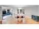 Dining room with hardwood floors, chandelier, and access to the living area at 6730 Gold Wagon Ln, Mint Hill, NC 28227