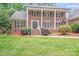 Charming two-story brick home with a well-maintained front yard at 6730 Gold Wagon Ln, Mint Hill, NC 28227