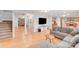 Bright living room with hardwood floors, grey sofas and fireplace at 6730 Gold Wagon Ln, Mint Hill, NC 28227