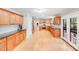 Bright kitchen with wood cabinets, stainless steel appliances, and ample counter space at 6730 Gold Wagon Ln, Mint Hill, NC 28227