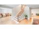 Bright staircase with wood and metal features leads to upper level, creating a warm and inviting atmosphere at 6730 Gold Wagon Ln, Mint Hill, NC 28227