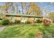 Traditional brick home with a well-manicured front yard and inviting entrance at 7000 David Ave, Charlotte, NC 28214