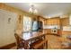 Eat-in kitchen featuring a wooden table set and appliances at 7000 David Ave, Charlotte, NC 28214