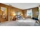 Comfortable living area with wood paneling and ample natural light at 7000 David Ave, Charlotte, NC 28214