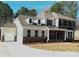 Charming two-story home with a spacious driveway and attached two-car garage at 7005 New Town Rd, Waxhaw, NC 28173