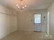 Bright dining area with classic chandelier and access to the backyard at 701 Dakota St, Kannapolis, NC 28083
