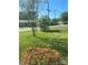 Landscaped front yard featuring green grass and azalea bushes at 701 Dakota St, Kannapolis, NC 28083