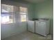 Light and bright laundry room with a side-by-side washer and dryer with a backyard view at 701 Dakota St, Kannapolis, NC 28083
