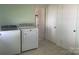 Laundry room with a side-by-side washer and dryer next to a utility closet at 701 Dakota St, Kannapolis, NC 28083