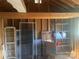 Interior of a shed with shelving and building materials including unpainted lumber and tools at 701 Dakota St, Kannapolis, NC 28083