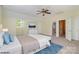 Light-filled bedroom with a ceiling fan, natural light, and a walk-in closet at 7900 Gilead Rd, Huntersville, NC 28078