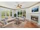 Living room showcasing a fireplace, natural light, and comfortable seating at 7900 Gilead Rd, Huntersville, NC 28078