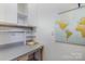 Workspace featuring a workbench, storage cabinets and a world map at 7900 Gilead Rd, Huntersville, NC 28078
