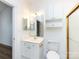 Well-lit bathroom with white vanity, sink, and gold fixtures at 9287 Meadow Vista Rd, Charlotte, NC 28213