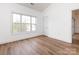 Bright bedroom with lots of sunlight, modern flooring, and entry to a large closet at 9287 Meadow Vista Rd, Charlotte, NC 28213