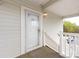 Close up of the condo's entrance, showing the door and railing leading up to it at 9287 Meadow Vista Rd, Charlotte, NC 28213