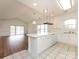 Open kitchen design with island, pendant lighting, and modern appliances at 9287 Meadow Vista Rd, Charlotte, NC 28213