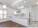 Kitchen and dining area with breakfast bar, white cabinets, and ample natural light at 9287 Meadow Vista Rd, Charlotte, NC 28213