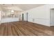 Bright living room features modern flooring, fresh white paint and a breakfast bar overlooking kitchen at 9287 Meadow Vista Rd, Charlotte, NC 28213