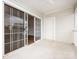 Spacious outdoor patio features sliding glass door and a white door at 9287 Meadow Vista Rd, Charlotte, NC 28213