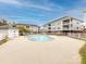 Outdoor pool and condos in a fenced in area at 9287 Meadow Vista Rd, Charlotte, NC 28213