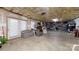 Unfinished basement with open ceiling, storage shelves, and space for various uses at 101 Saddletree Rd, Lincolnton, NC 28092