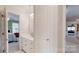 Bright bathroom featuring double sinks, white cabinets, and an attached bedroom at 101 Saddletree Rd, Lincolnton, NC 28092