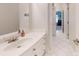 Clean bathroom with white cabinets, tiled floors, and a sleek countertop at 101 Saddletree Rd, Lincolnton, NC 28092