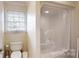 Bathroom features a shower stall with a white curtain, toilet, and a window at 101 Saddletree Rd, Lincolnton, NC 28092